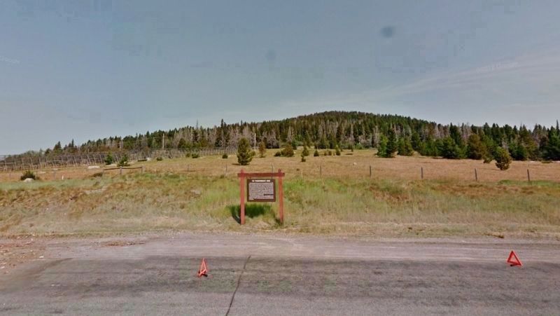 The Frenchwoman's Road Marker (<i>wide view looking north from U.S. Highway 12</i>) image. Click for full size.