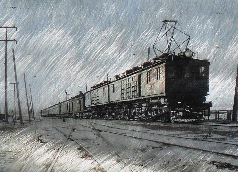 Marker detail: Box-cab engine under catenary lines c.1916 image. Click for full size.