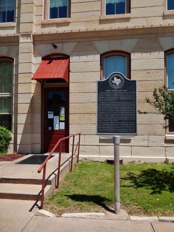 Honey Grove City Hall Marker (<i>tall view; City Hall south entrance in background</i>). Click for full size. Honey Grove City Hall Marker (<i>tall view; City Hall south entrance in background</i>) image. Click for full size.