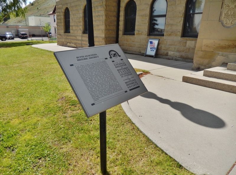 Butte-Anaconda Historic District Marker (<i>wide view; Deer Lodge County Courthouse background</i>) image. Click for full size.