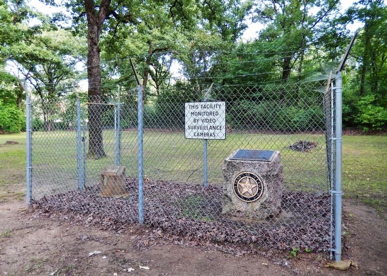 Titus County Marker (<i>wide view showing security fence surrounding marker</i>) image. Click for full size.