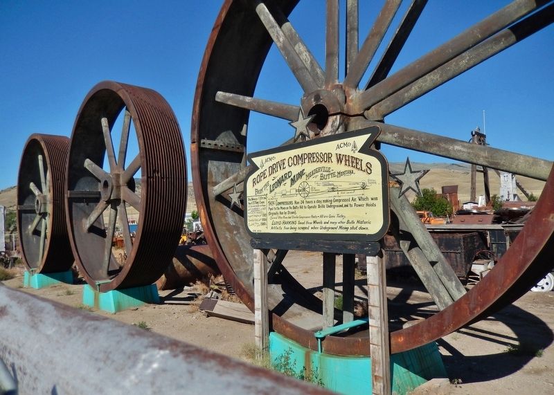 Rope Drive Compressor Wheels Marker (<i>wide view; giant compressor wheels in background</i>) image. Click for full size.