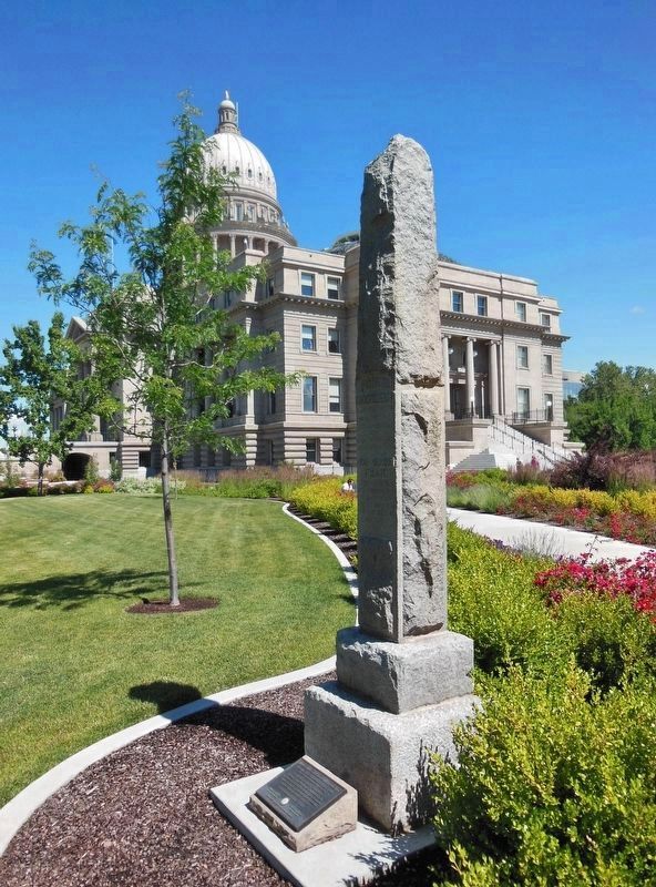 Oregon Trail Monument (<i>at base of original 1906 marker; Idaho State Capitol in background</i>) image. Click for full size.