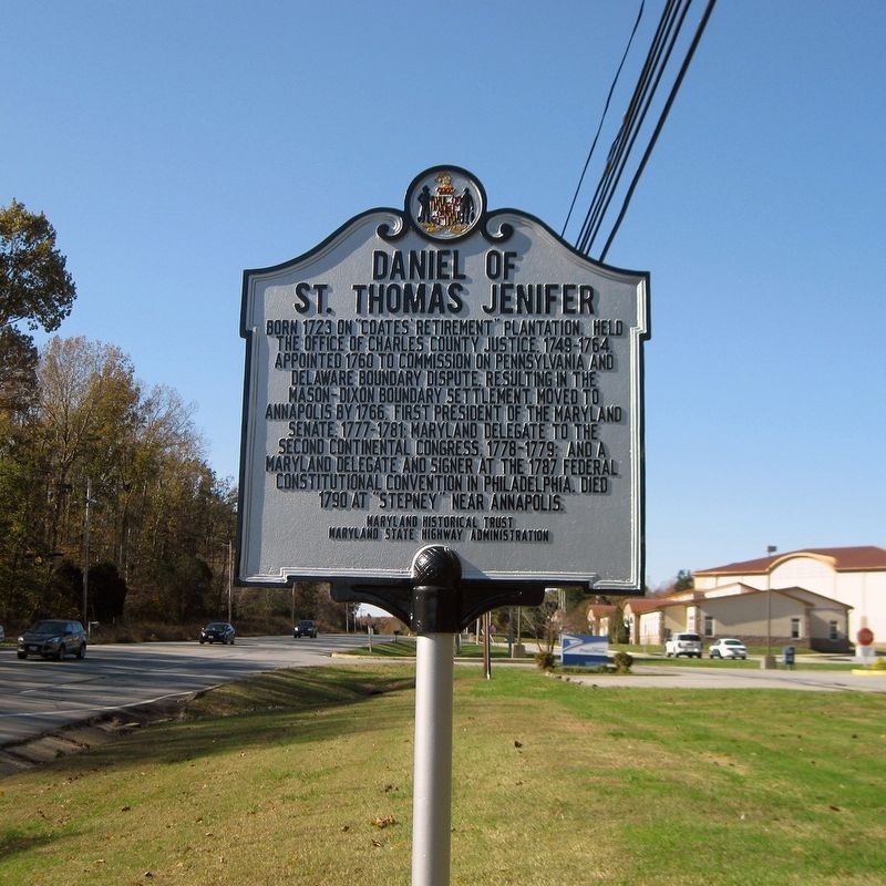 Daniel of St. Thomas Jenifer Marker with Port Tobacco Post Office entrance sign in background. image. Click for full size.