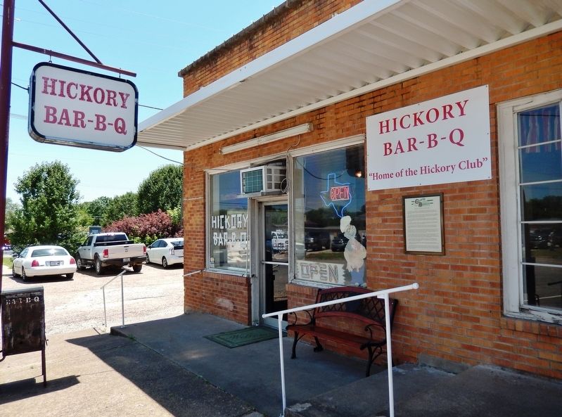 John Wesley Hardin Marker (<i>wide view; marker mounted on wall, under restaurant sign</i>) image. Click for full size.