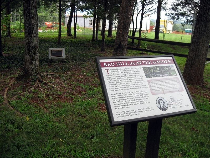 Red Hill Scatter Garden Marker with the Scatter Garden plaque in the background. image. Click for full size.