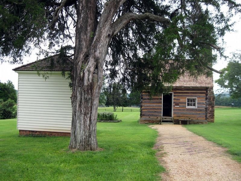 Exteriors of the Smokehouse (left) and the Slave Cabin (Right). image. Click for full size.