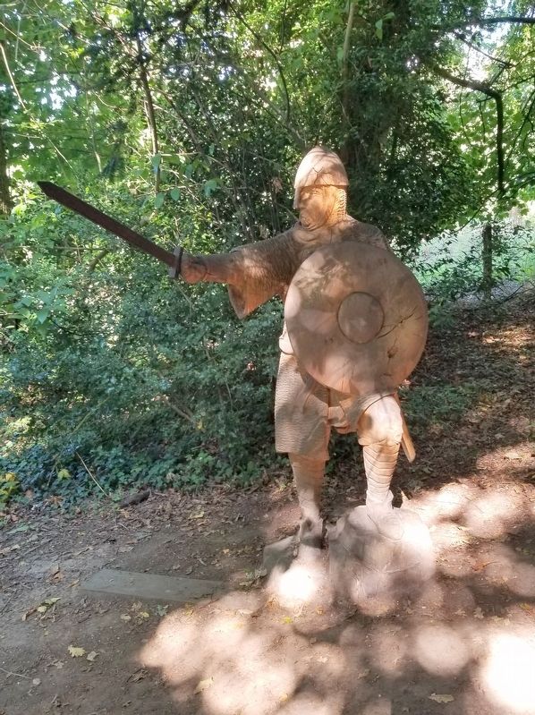 A wooden sculpture of an English soldier on the battlefield path. Click for full size. A wooden sculpture of an English soldier on the battlefield path image. Click for full size.