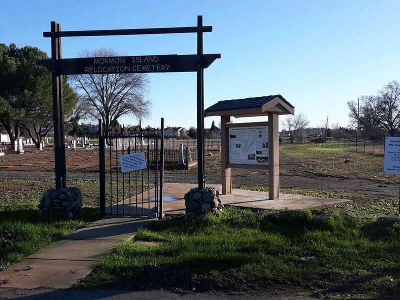 Mormon Island Relocation Cemetery Marker With Cemetery in the Background. Click for full size. Mormon Island Relocation Cemetery Marker With Cemetery in the Background image. Click for full size.