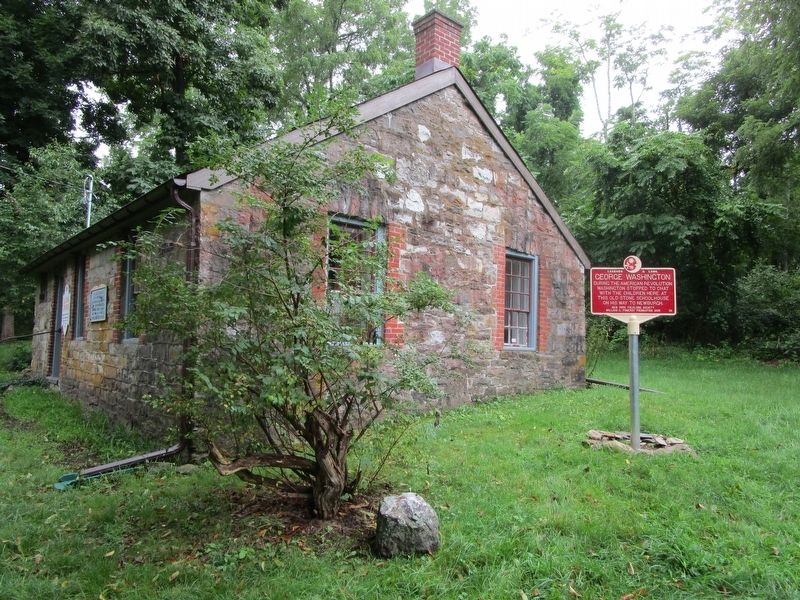 George Washington Marker next to old stone schoolhouse image. Click for full size.