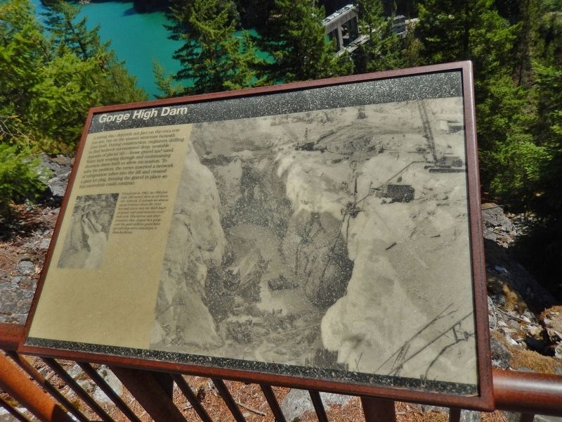 Gorge High Dam Marker (<i>wide view; dam in background</i>) image. Click for full size.