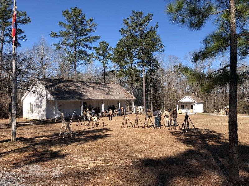 View of barracks building during the Independent Rifles Winter Quarters of 1862 reenactment. image. Click for full size.