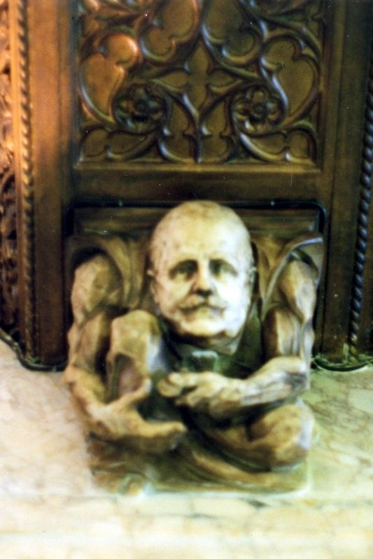The gargoyle of F.W. Woolworth, counting his nickels. image. Click for full size.