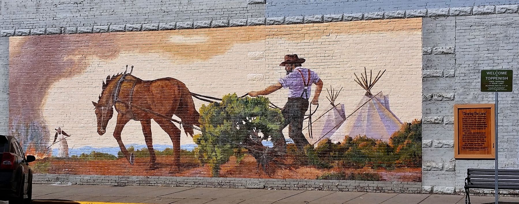 Clearing the Land Marker (<i>wide view; marker on right, mural on left</i>). Click for full size. Clearing the Land Marker (<i>wide view; marker on right, mural on left</i>) image. Click for full size.