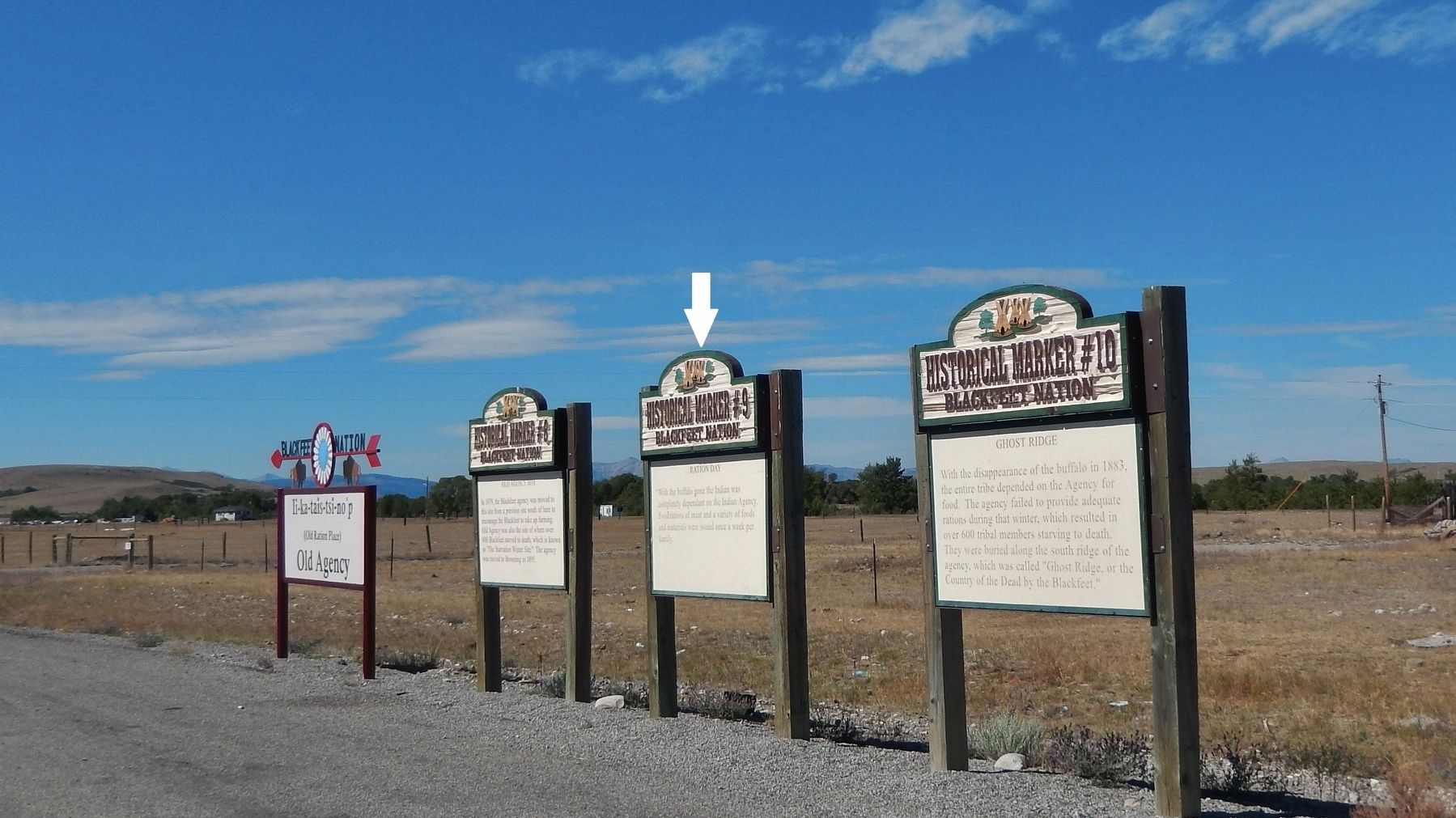 Ration Day Marker (<i>wide view; center of three historical markers at this site</i>) image. Click for full size.