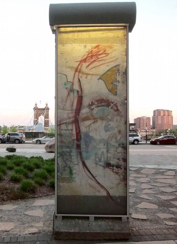 The Berlin Wall Marker - wider view, looking south, with Roebling Bridge and Covington in background image. Click for full size.