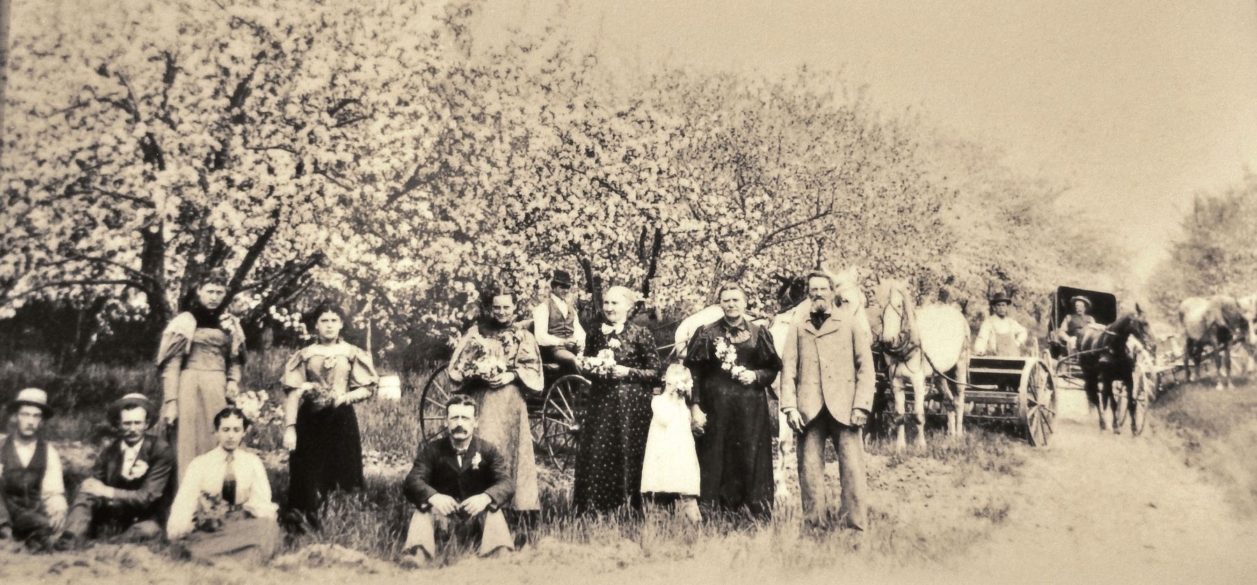 Marker detail: Joseph Zettel (foreground, right) and family display their renowned orchard, c. 1900 image. Click for full size.