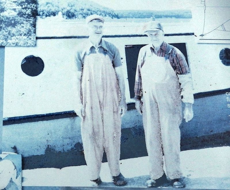 Marker detail: Emery and Howard Weborg in front of the <i>Skipper</i> image. Click for full size.