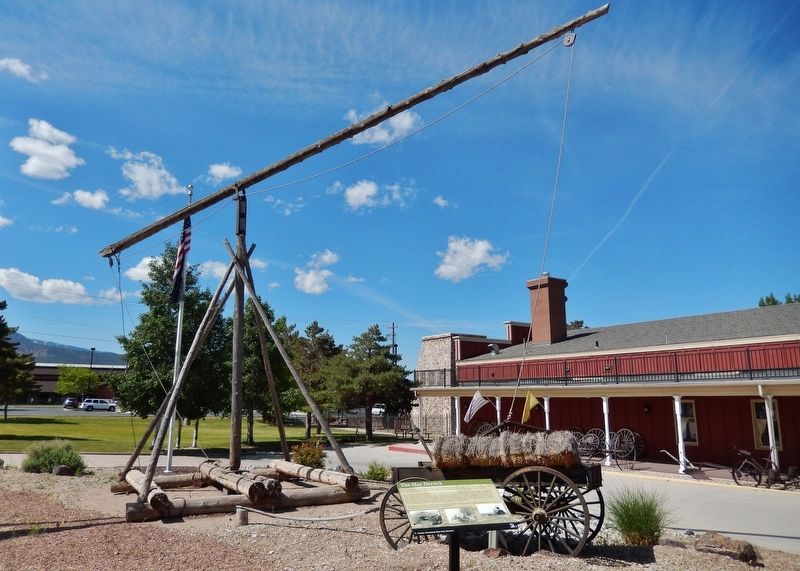The Hay Derrick Marker (<i>wide view; hay derrick in background; museum to right</i>) image. Click for full size.