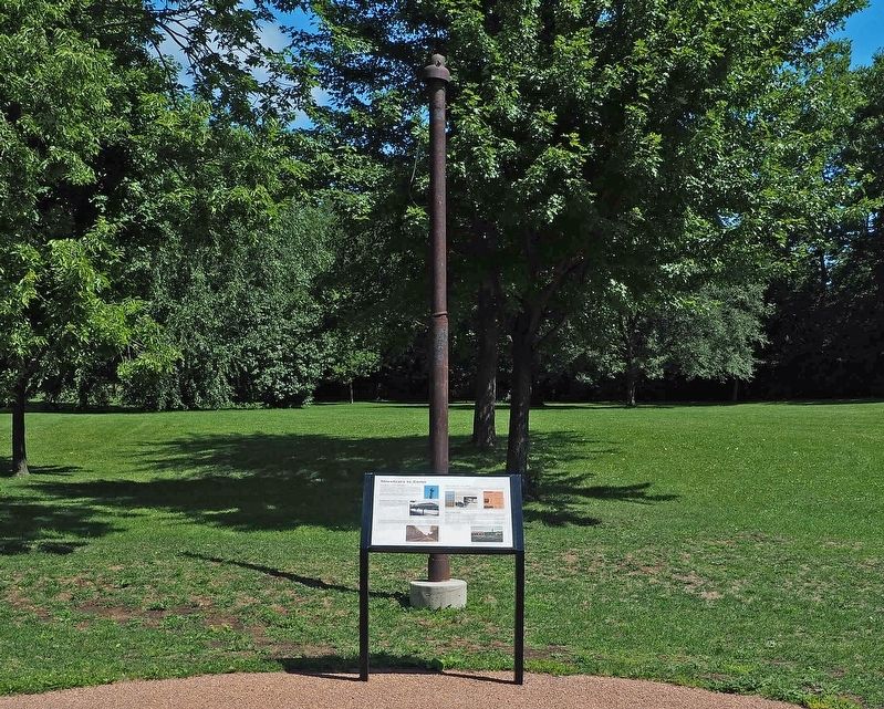 Marker and original streetcar guide pole. Click for full size. Marker and original streetcar guide pole image. Click for full size.