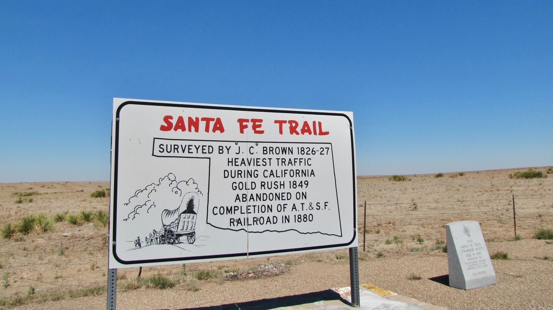 Santa Fe Trail Marker (<i>wide view; showing adjacent Santa Fe Trail sign on left</i>) image. Click for full size.