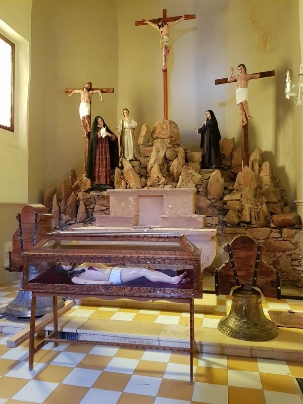 A depiction of a Calvary scene in the nearby Catholic church image. Click for full size.