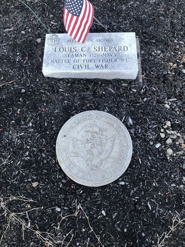 Plaque in front of the memorial image. Click for full size.