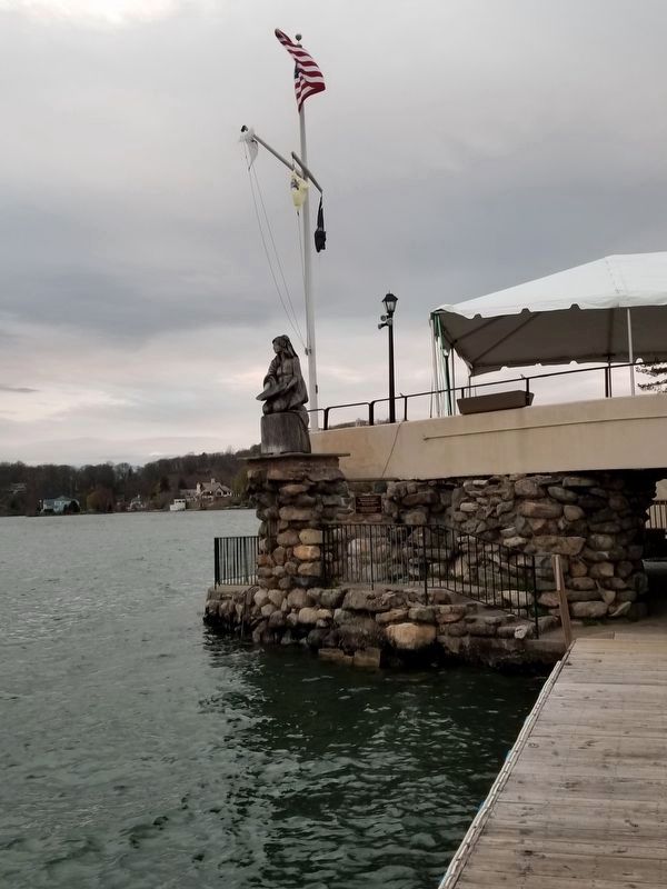 A wooden sculpture of Princess White Deer overlooks Lake Mohawk image. Click for full size.