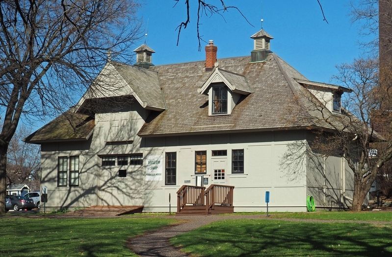 The reconstructed carriage house, starting point for house tours image. Click for full size.