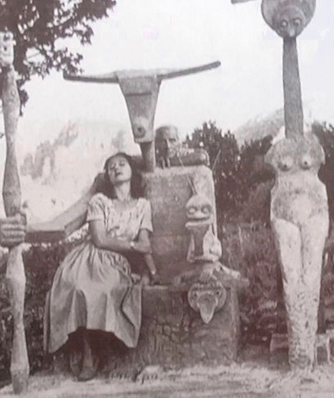 Max Ernst and his wife Dorothea, with his most famous sculpture - Capricorn. image. Click for full size.
