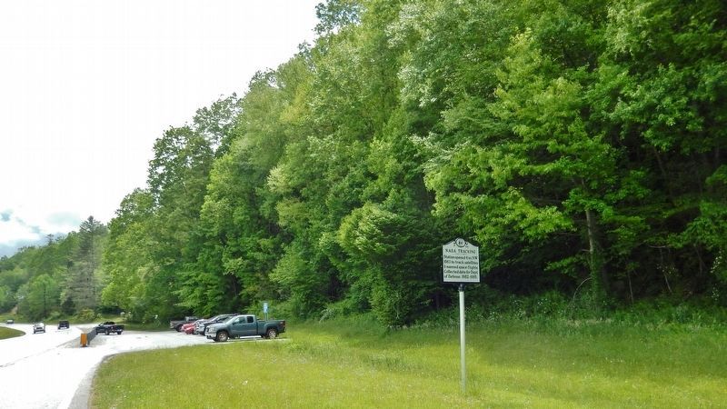 NASA Tracking Marker (<i>view looking south along US-64; rideshare parking lot in background</i>) image. Click for full size.