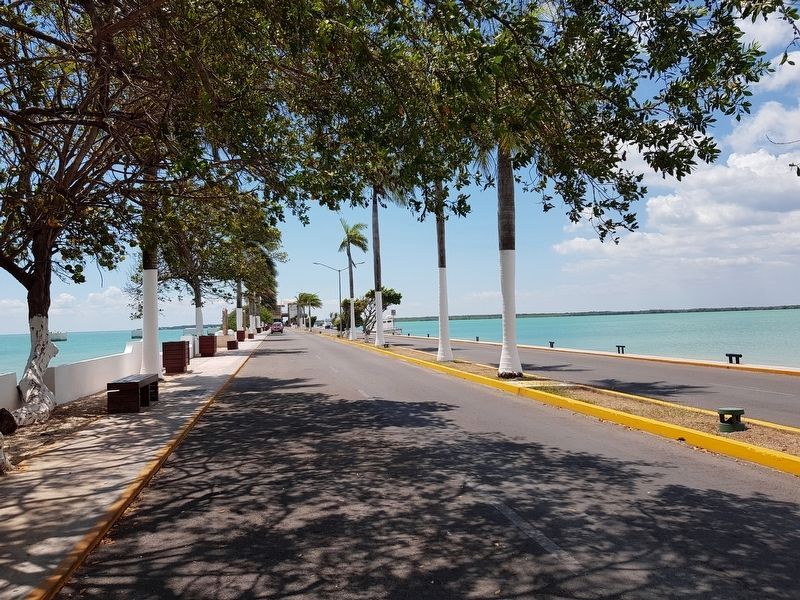 A view towards the south along the Chetumal pier and migration/port building at its end. image. Click for full size.