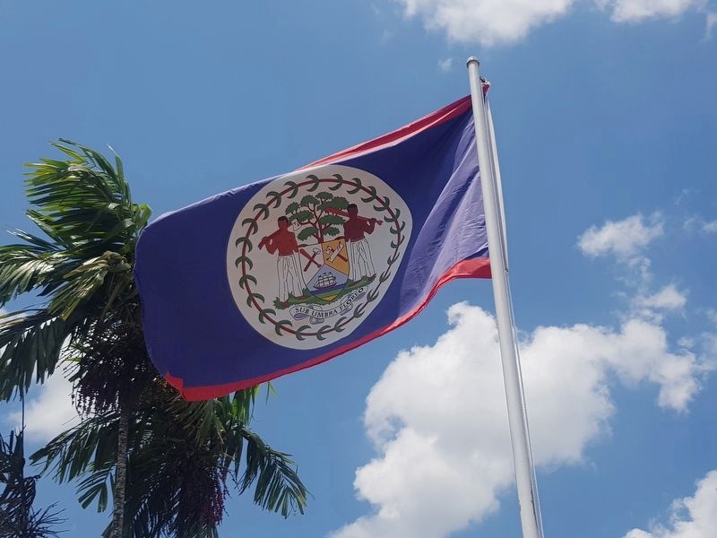 A nearby Belizean flag showing the symbolism mentioned in the marker text image. Click for full size.