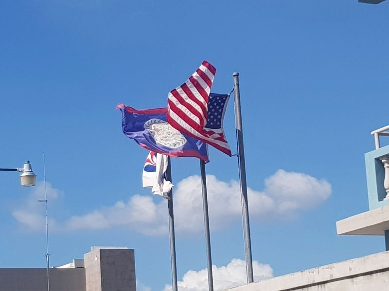 The flags of Belize and the United States of America flying at the nearby Peace Corps office image. Click for full size.