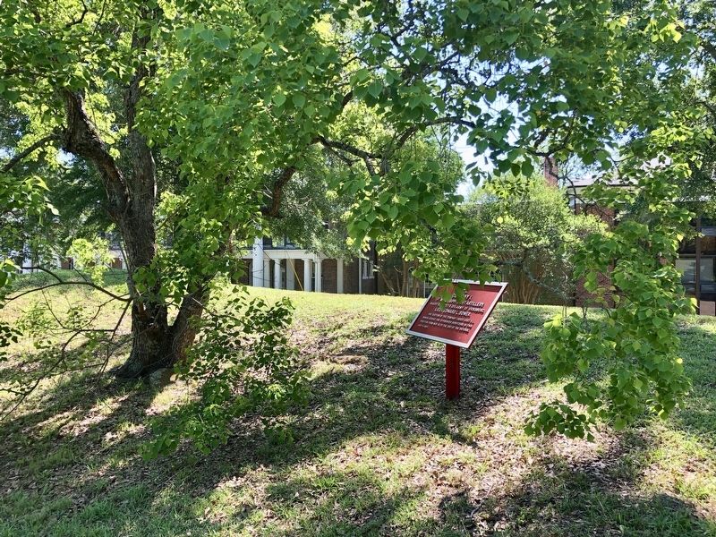 View of marker with AmeriCorps building in background. image. Click for full size.