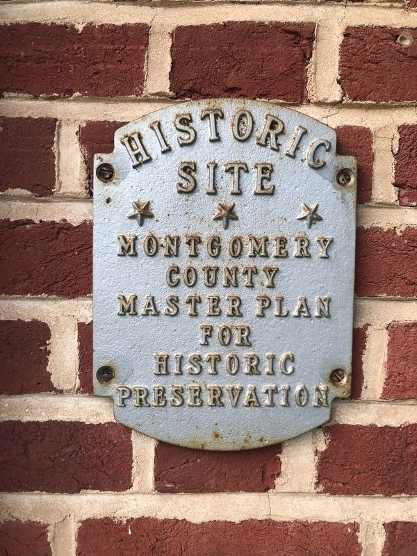 Additional plaque on the other side of the doorway image. Click for full size.