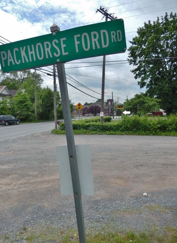 Packhorse Ford Road sign (<i>marker visible in background, across road, on right</i>) image. Click for full size.