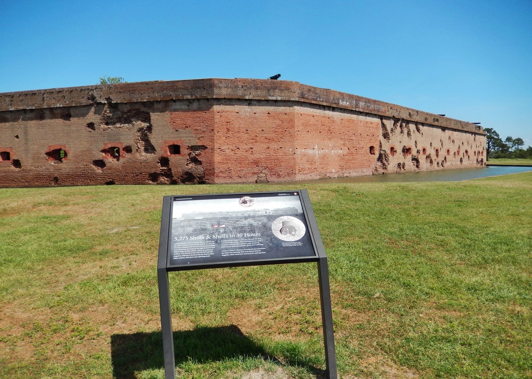 5,275 Shots & Shells Marker (<i>wide view • damaged south & east walls in background</i>) image. Click for full size.