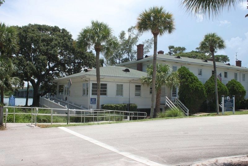 World War II U.S. Naval Housing Building Marker on left and visitors center. Click for full size. World War II U.S. Naval Housing Building Marker on left and visitors center image. Click for full size.
