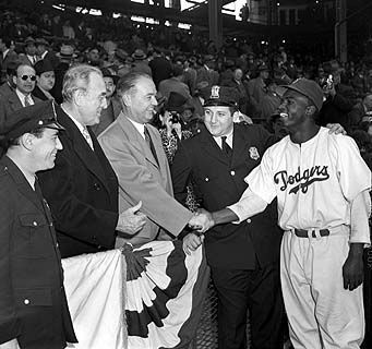 Jackie Robinson with Brooklyn Borough President John Cashmore at Ebbets Field in 1947. image. Click for full size.
