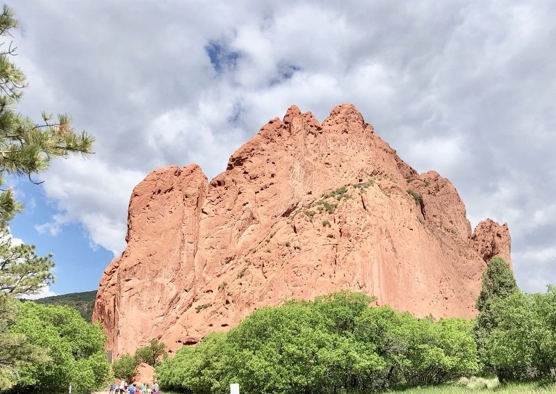 The Garden of the Gods Marker on North Gateway Rock (on left above walkers). image. Click for full size.