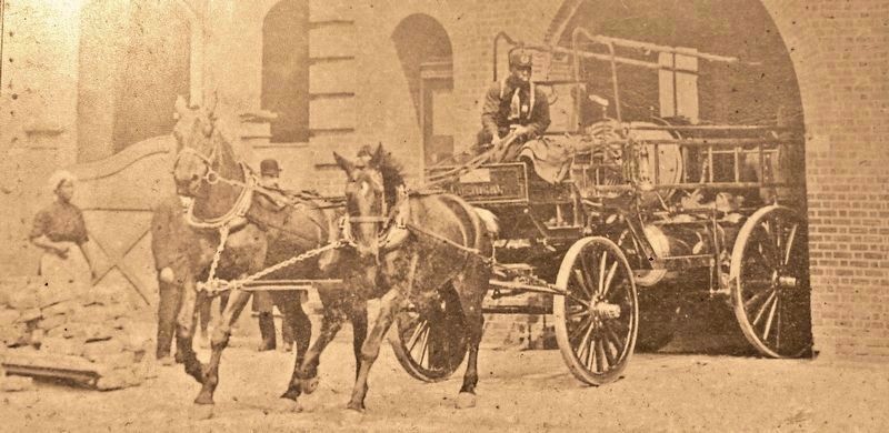 Marker detail: Horse-pulled fire pump leaving the station image. Click for full size.