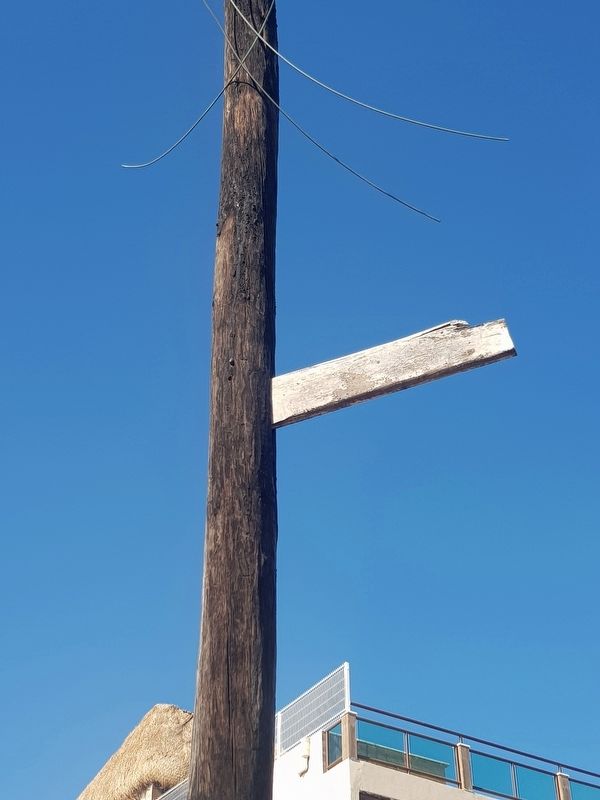 A view of the replica of the board driven into the light post by Hurricane Janet image. Click for full size.