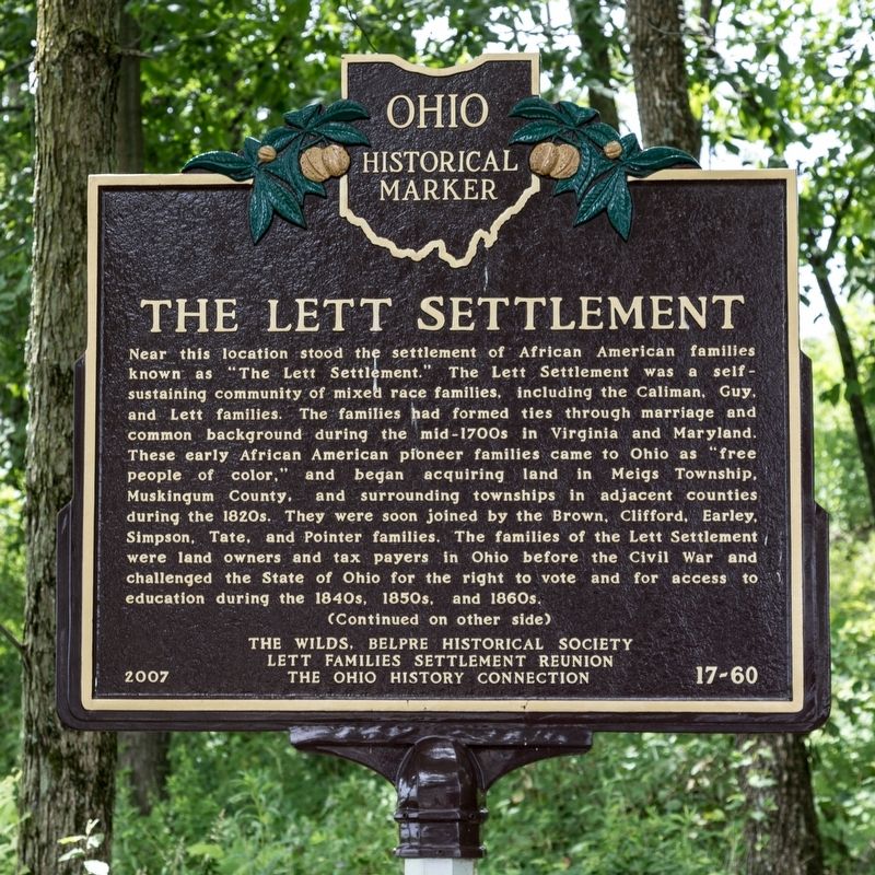The Lett Settlement Marker, side one image. Click for full size.
