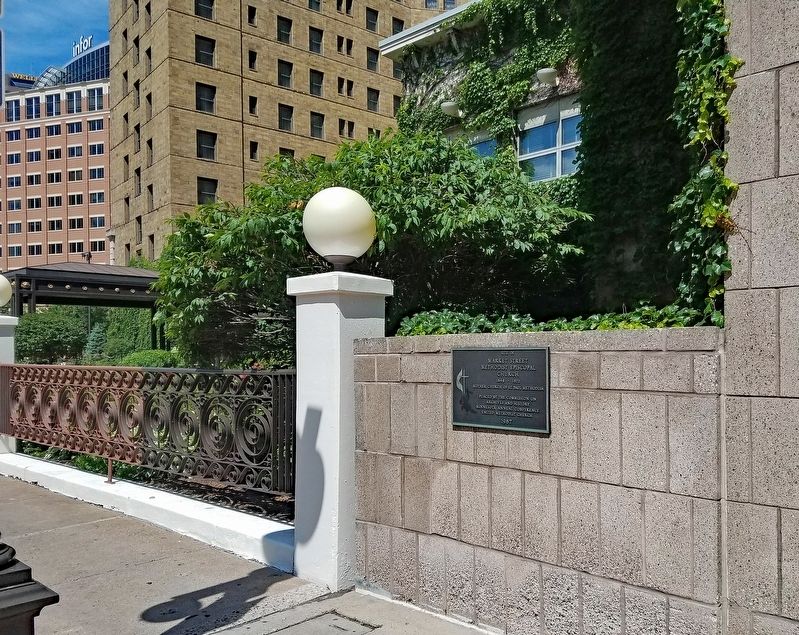 Marker mounted on corner of parking ramp next to the Saint Paul Hotel image. Click for full size.