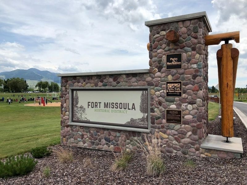 Nearby Fort Missoula entry sign and city, county and national dedication plaques image. Click for full size.