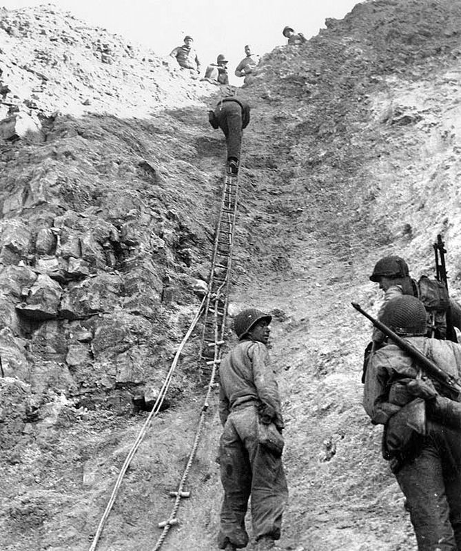 Rangers from 2nd Ranger Battalion demonstrate the rope ladders they used to scale Pointe du Hoc. image. Click for full size.