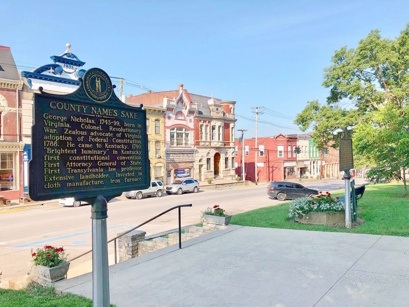 View of marker looking south at Main Street businesses. image. Click for full size.