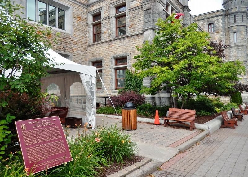 The Royal Canadian Mint Marker<br>(<i>wide view • southeast corner mint building in background</i>). Click for full size. The Royal Canadian Mint Marker<br>(<i>wide view • southeast corner mint building in background</i>) image. Click for full size.