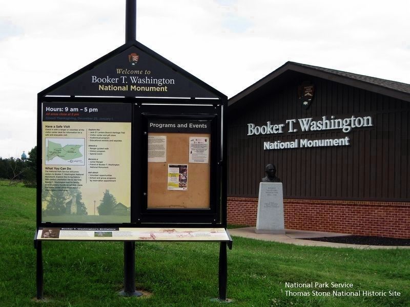 Booker T. Washington's Birthplace Marker and bulletin board image. Click for full size.